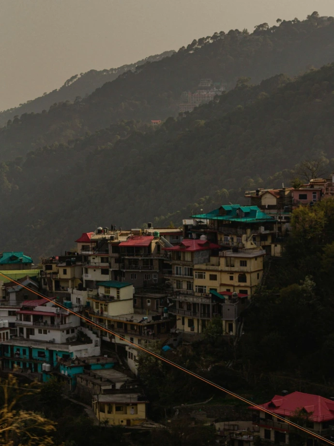 a view of a city with mountains in the background